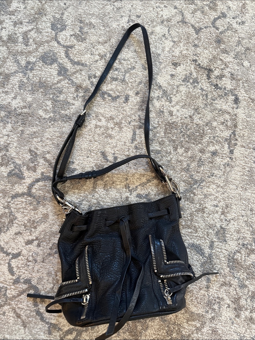 Black Leather Drawstring Shoulder Bag with Zip Pocket Accents